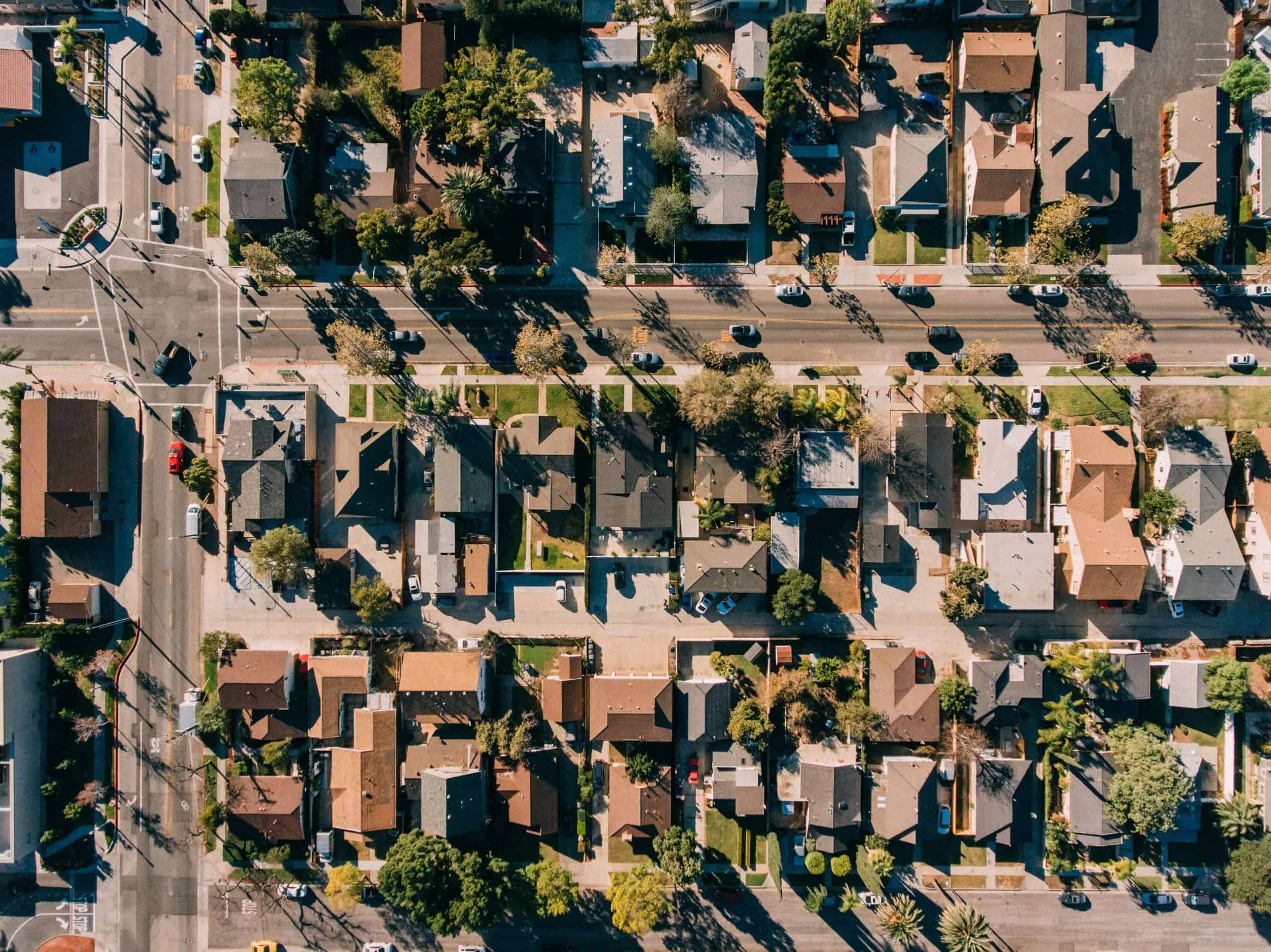 Aerial view of a well-maintained suburban neighborhood representing organized, professional HOA management.